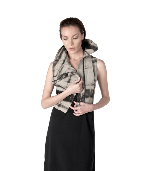 plant dyed cropped women sleeveless vest with high flared collar.  Zippers along waist line.  Hand cast snake claw front zipper pull.