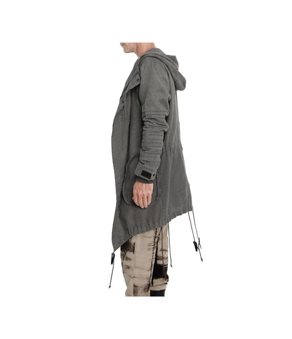 Unisex 100% linen parka. Made of light weight linen. Featuring large lined hood, hidden snaps over front zip fastening, long sleeves with ribbed detail, snaps on cuffs, a drawstring waist, front frayed edge pockets, leather detail on cuffs, collar and back, leather tassel zip on outside chest pocket, earphone loop on inside chest pocket, and adrawstring hem.