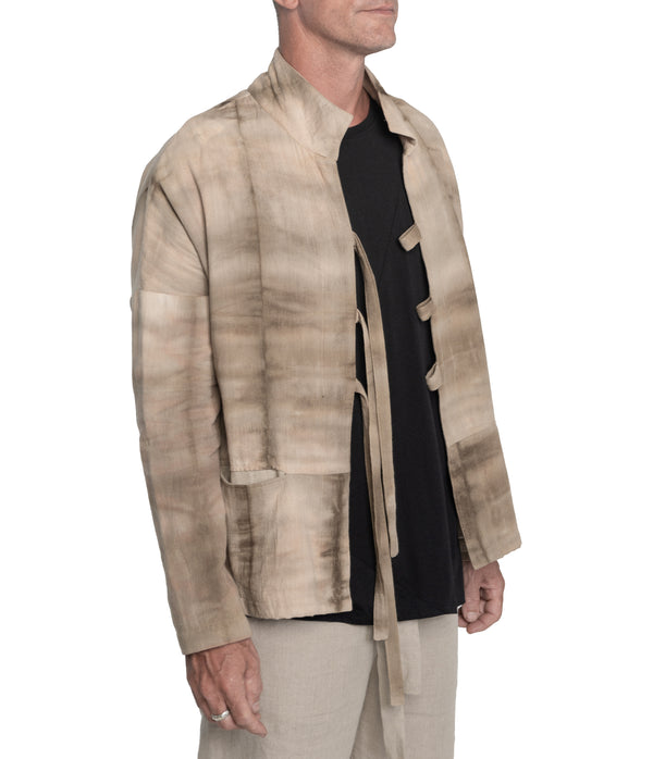 Kimono style jacket crafted from 100% plant dyed cotton, 3 front-tie fastening and 2 front pockets.